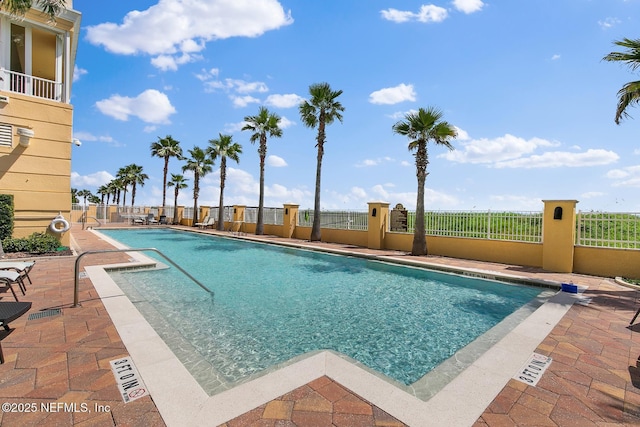 view of swimming pool with a patio