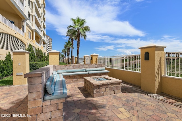 view of patio with an outdoor fire pit