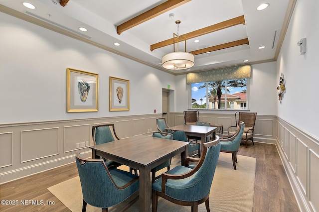 dining room featuring beamed ceiling, dark hardwood / wood-style floors, and crown molding