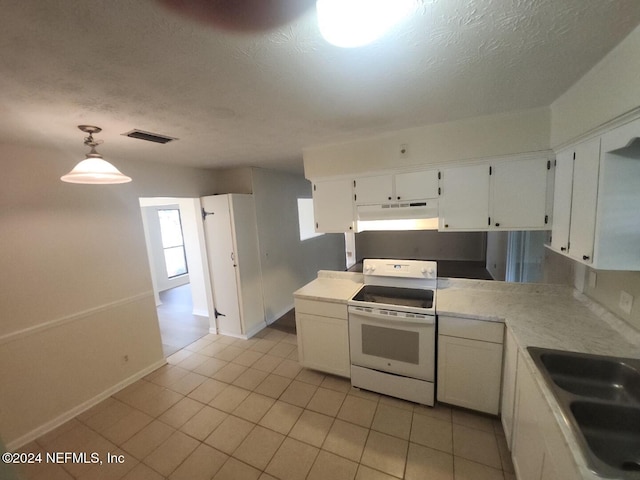 kitchen with a sink, white cabinets, light countertops, white range with electric stovetop, and pendant lighting