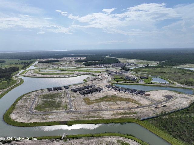 bird's eye view with a water view