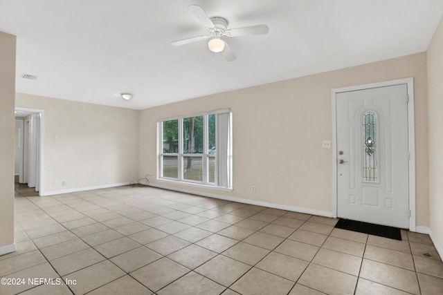 foyer entrance featuring ceiling fan and light tile patterned floors