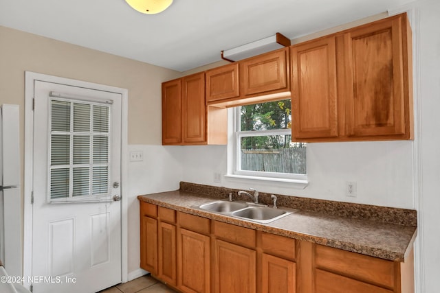 kitchen with sink and light tile patterned floors