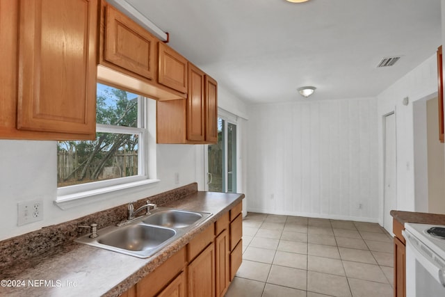 kitchen with sink and light tile patterned floors