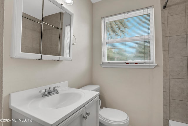 bathroom with vanity and toilet