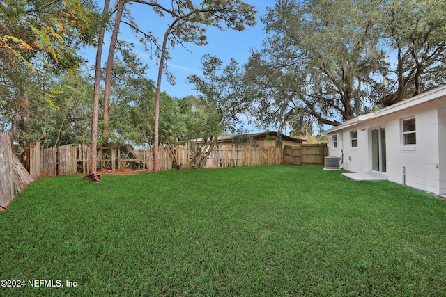 view of yard featuring central AC