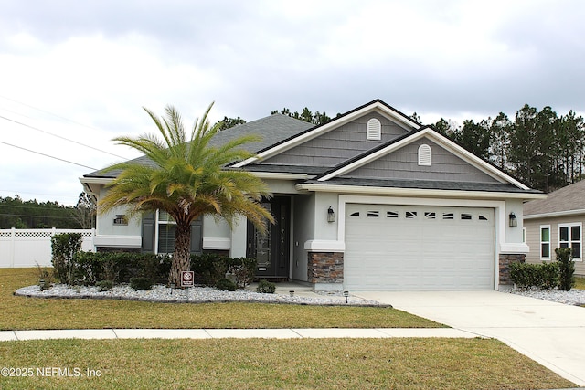 view of front facade with a garage and a front lawn