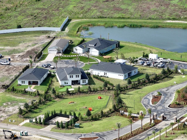 birds eye view of property with a water view