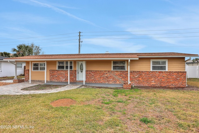 ranch-style house with a front lawn