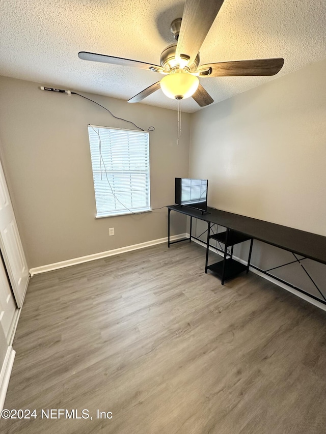 4266 Key Adam Dr, Jacksonville, FL 32218 - office space with ceiling fan, a textured ceiling, and dark wood-type flooring