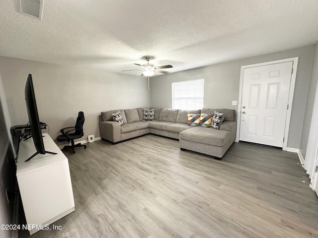 4266 Key Adam Dr, Jacksonville, FL 32218 - living room with ceiling fan, hardwood / wood-style floors, and a textured ceiling