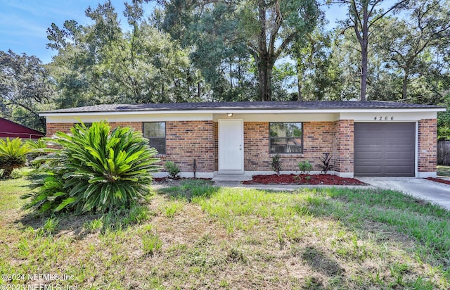 single story home featuring a garage