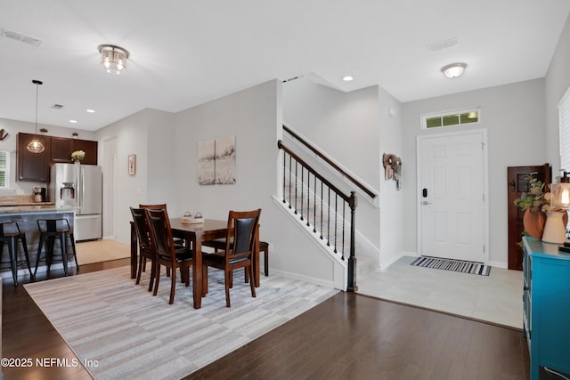 dining space featuring light hardwood / wood-style floors