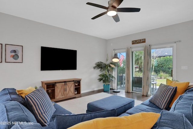 living room with hardwood / wood-style flooring and ceiling fan