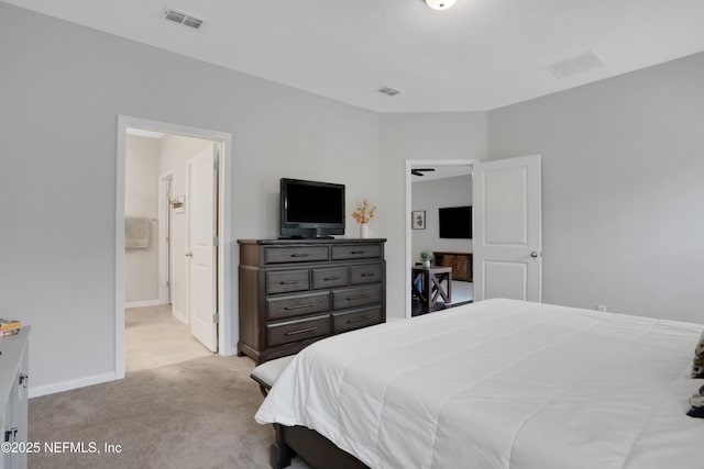 carpeted bedroom with connected bathroom