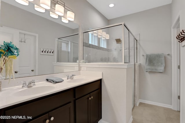 bathroom featuring an enclosed shower and vanity