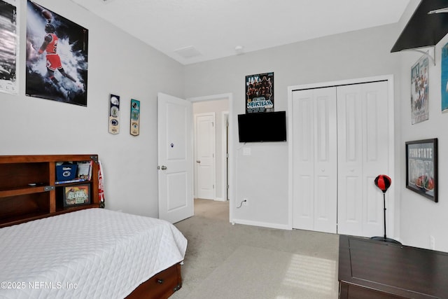 carpeted bedroom with a closet