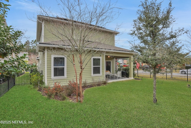 back of property featuring a patio and a yard