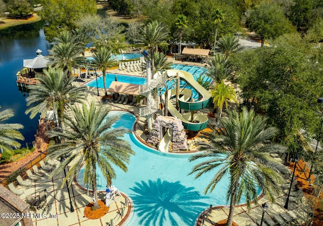 view of swimming pool featuring a water view and a water slide