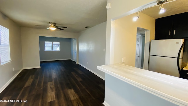 kitchen featuring kitchen peninsula, refrigerator, dark hardwood / wood-style floors, and ceiling fan