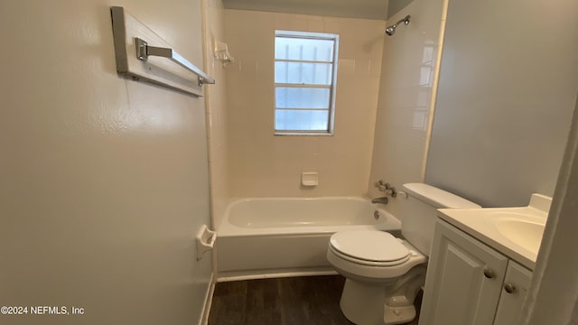 full bathroom featuring toilet, vanity, tiled shower / bath combo, and hardwood / wood-style flooring