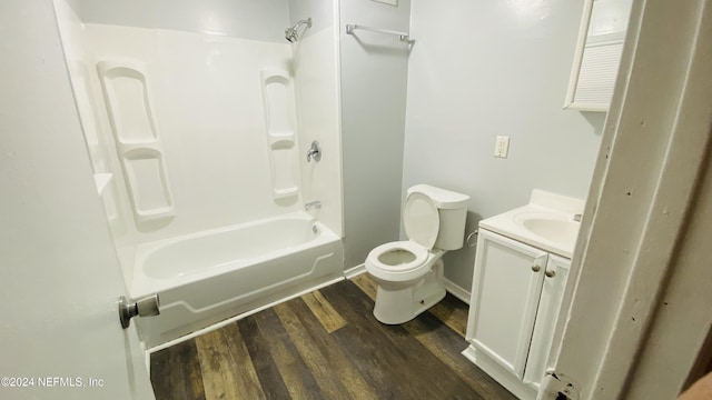 full bathroom featuring hardwood / wood-style floors, vanity, toilet, and shower / tub combination