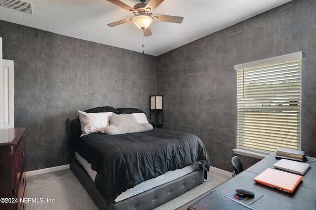 bedroom with ceiling fan and light colored carpet