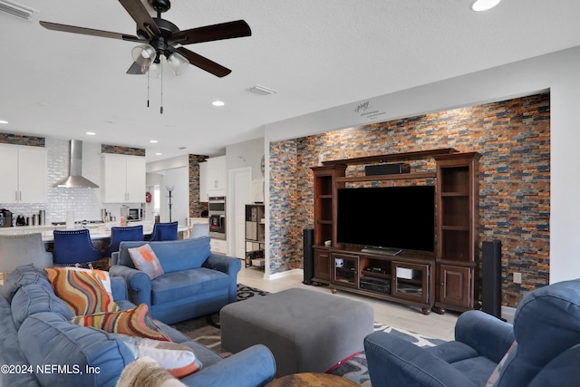 tiled living room with ceiling fan