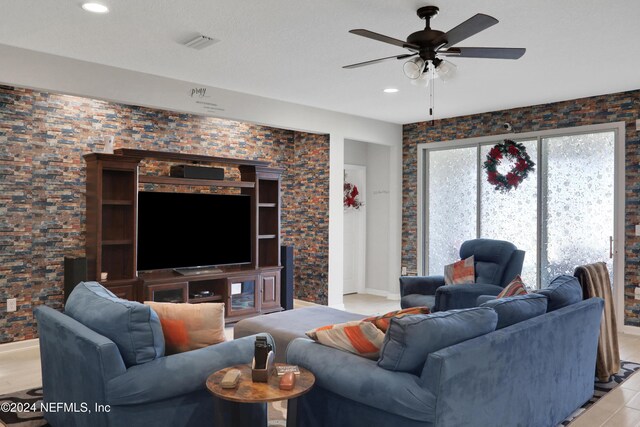 living room with ceiling fan and light hardwood / wood-style floors