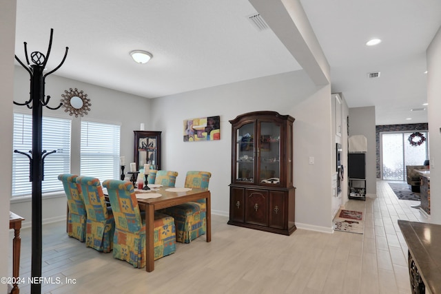 dining space featuring light hardwood / wood-style floors