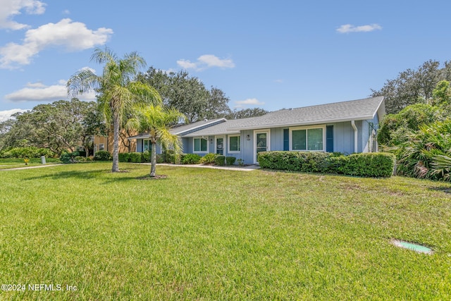 single story home featuring a front yard