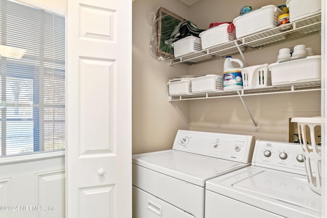 laundry area with independent washer and dryer