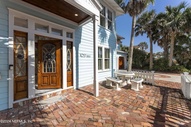 entrance to property featuring a porch