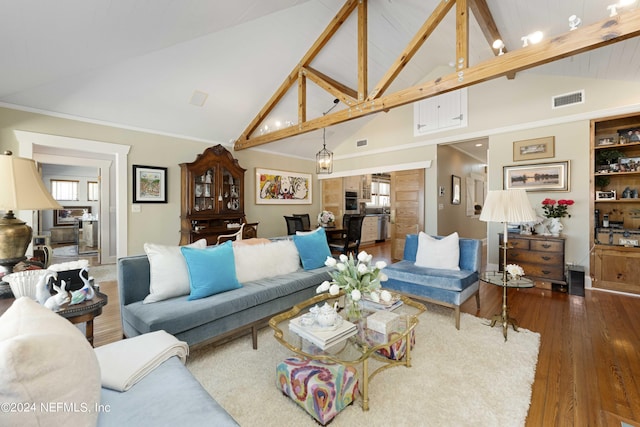 living room with beam ceiling, dark hardwood / wood-style flooring, and high vaulted ceiling