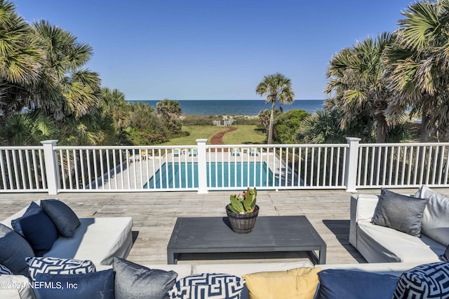 view of swimming pool featuring outdoor lounge area and a water view