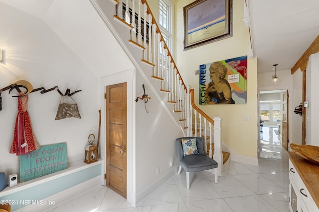 stairs featuring a wealth of natural light