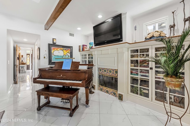 miscellaneous room featuring beam ceiling