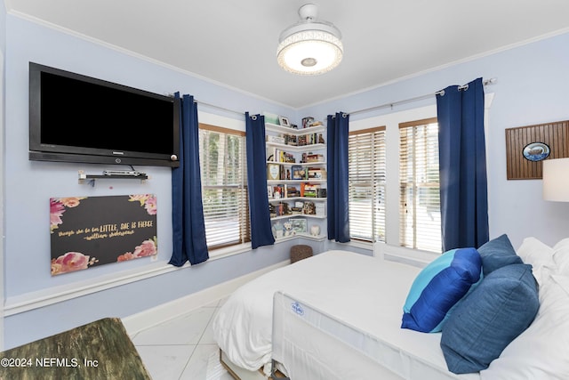 bedroom featuring tile patterned floors and crown molding