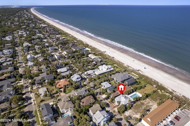 bird's eye view with a water view and a view of the beach