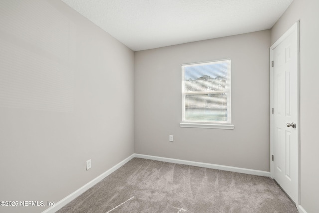 empty room with light colored carpet