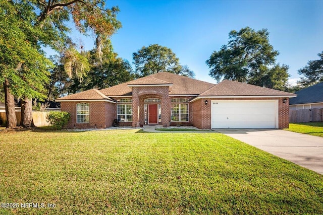 view of front facade with a garage and a front yard