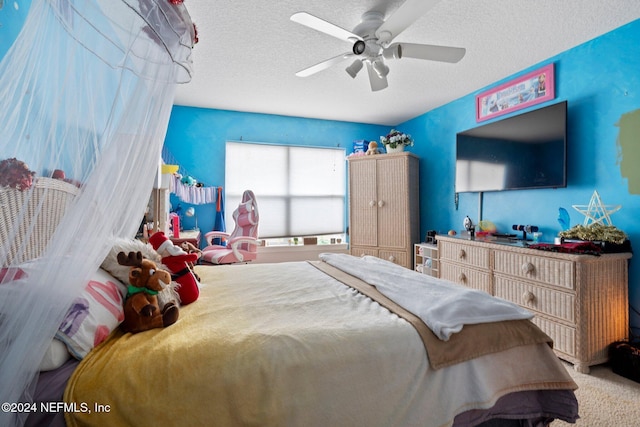 bedroom with a textured ceiling and ceiling fan