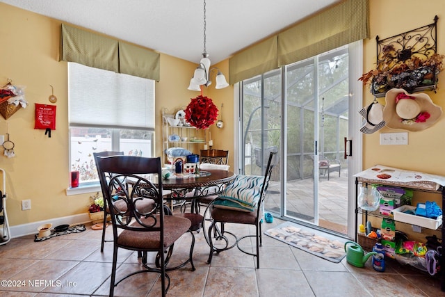 tiled dining space with a healthy amount of sunlight