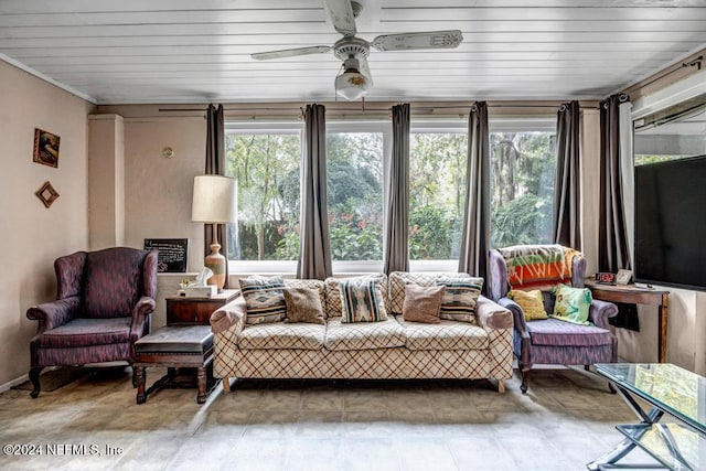 sunroom featuring ceiling fan