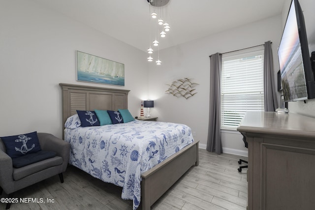 bedroom with light hardwood / wood-style flooring