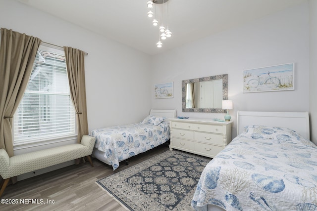 bedroom featuring wood-type flooring