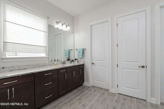 bathroom featuring vanity and hardwood / wood-style floors