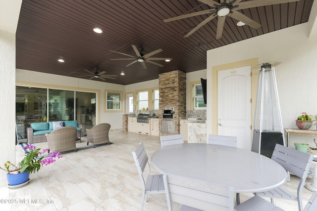 view of patio / terrace with grilling area, outdoor lounge area, and exterior kitchen