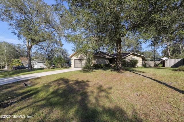 ranch-style home featuring a front yard and a garage