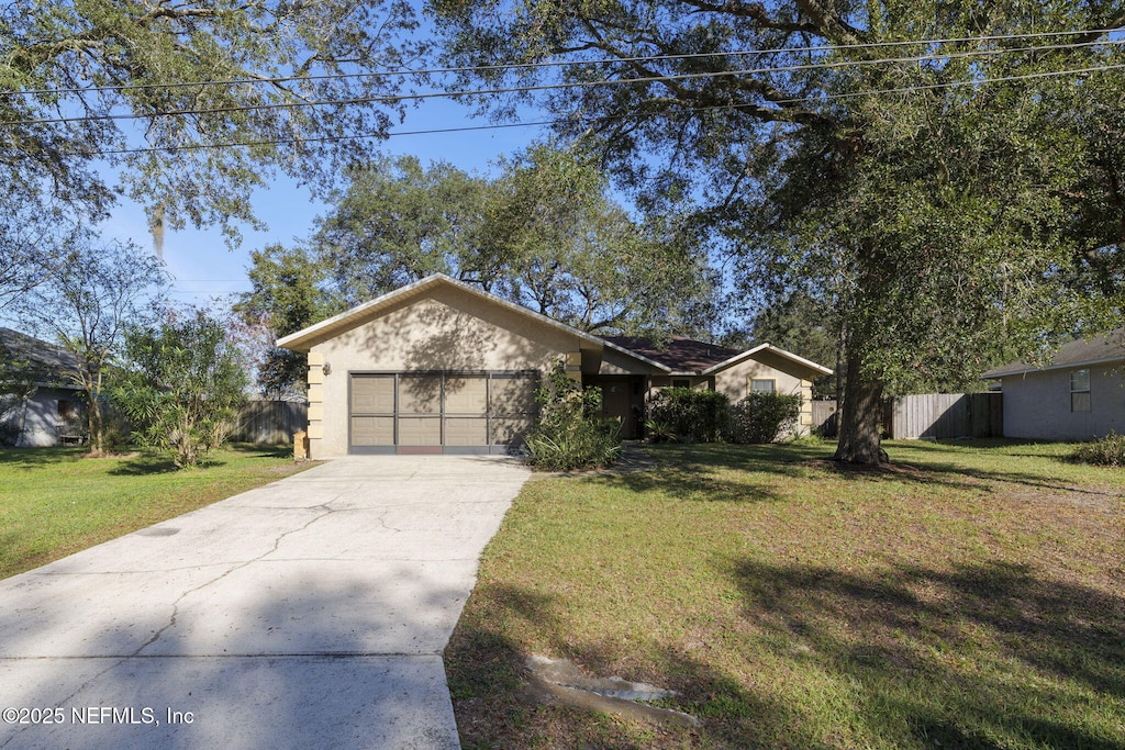 single story home with a front yard and a garage